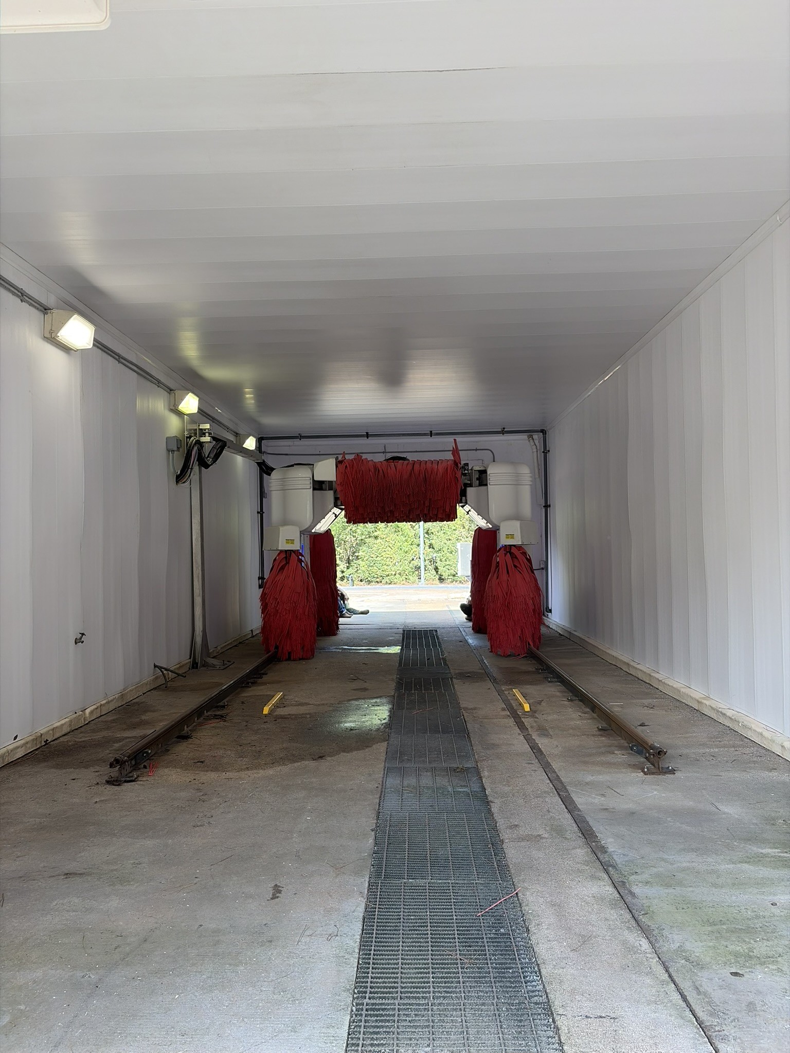 Completed car-wash bay wall and ceiling panel improvements